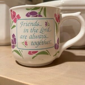 Floral mug says “Friends in the Lord Are Always Together”